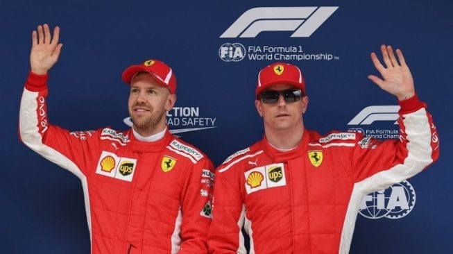 Duet pebalap Ferrari F1, Sebastian Vettel dan Kimi Raikkonen. [AFP/Greg Baker]