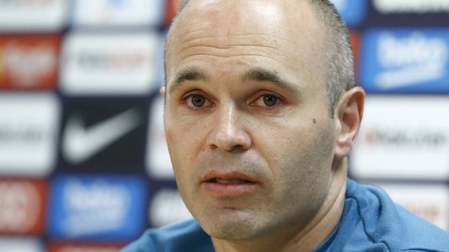 Andres Iniesta mengumumkan akan meninggalkan Barcelona di akhir musim ini. Pau Barrena / AFP