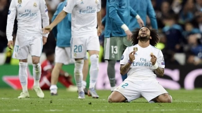 Reaksi pemain Real Madrid Marcelo setelah timnya menyingkirkan Bayern Munich di semifinal Liga Champions [AFP]