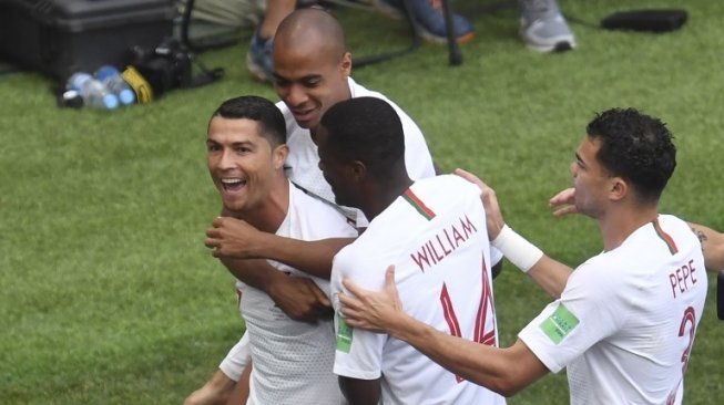 Pemain Portugal Cristiano Ronaldo rayakan golnya ke gawang Maroko dalam laga kedua Grup B Piala Dunia 2018 yang berlangsung di Stadion Luzhniki, Rabu (20/6/2018) [AFP]