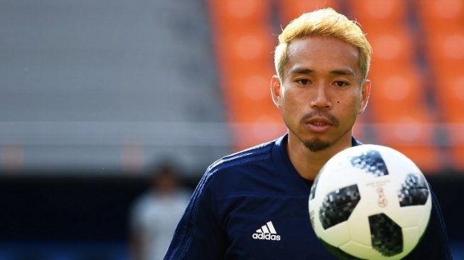 Pemain Jepang Yuto Nagatomo berlatih bersama rekan-rekannya guna menghadapi Belgia di babak 16 besar Piala Dunia 2018 [AFP]