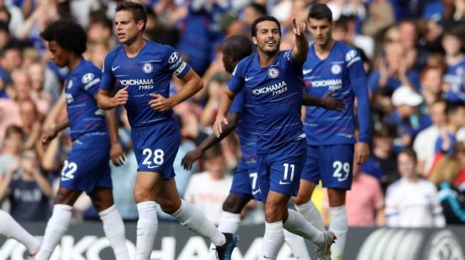 Gelandang Chelsea asal Spanyol Pedro (kedua kanan) merayakan golnya bersama rekan setimnya ke gawang Arsenal di Stamford Bridge, London. Daniel LEAL-OLIVAS / AFP