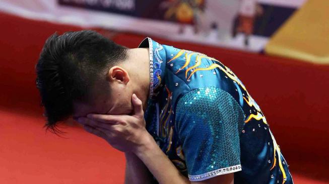 Atlet Wushu Indonesia Edgar Xaier Marvelo saat tampil di nomor Chanquan Putra pada Asian Games 18 di JEXPO, Kemayoran, Jakarta, Minggu (19/8). ANTARA FOTO/INASGOC/ Gino F Hadi