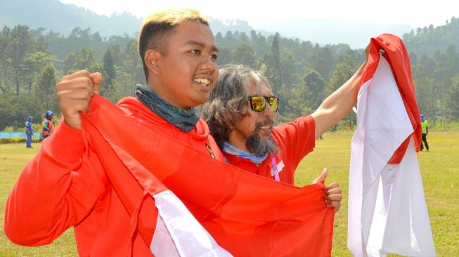 Jafro Megawanto, berhasil meraih medali emas untuk nomor ketepatan mendarat perseorangan putra, setelah menyelesaikan babak kesepuluh,Asian Games 2018.[ANTARA FOTO/INASGOC]