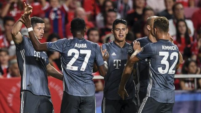 Para pemain Bayern Munich merayakan gol ke gawang Benfica. [PATRICIA DE MELO MOREIRA / AFP]