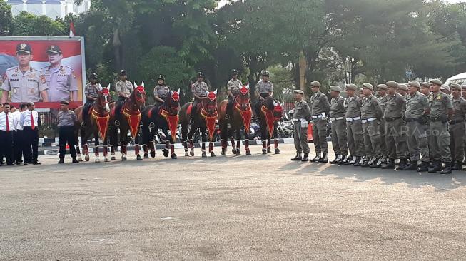 Apel gabungan pasukan pengamanan Asian Para Games 2018 di Lapangan Promoter Ditlantas Polda Metro Jaya, Rabu (3/10/2018). [Suara.com/Agung Sandy Lesmana]