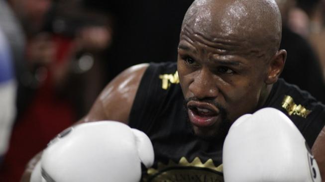 Mantan juara dunia tinju di lima kelas berbeda asal Amerika Serikat, Floyd Mayweather Jr. [AFP/John Gurzinski]