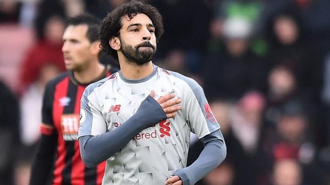 Pemain Liverpool Mohamed Salah merayakan golnya ke gawang AFC Bournemouth pada pertandingan Liga Inggris di Vitality Stadium. Glyn KIRK / AFP