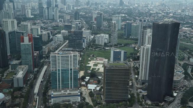 Suasana kawasan padat penduduk di Jakarta, Jumat (21/12). [Suara.com/Muhaimin A Untung]