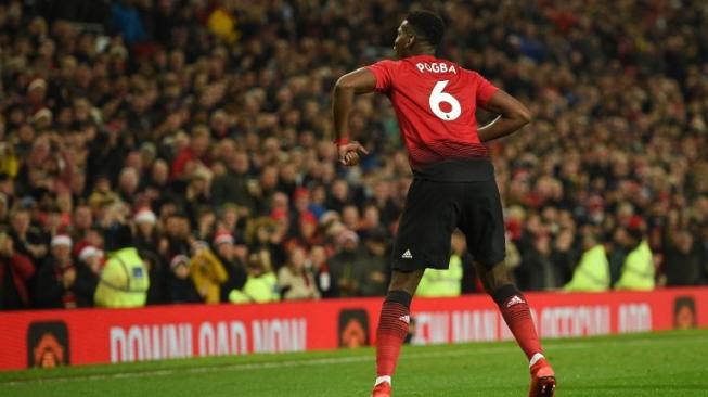 Gelandang MU, Paul Pogba, merayakan gol keduanya ke gawang Huddersfield Town dalam lanjutan Liga Inggris bertajuk Boxing Day di Old Trafford, Rabu (26/12/2018). [AFP/Oli Scarff]