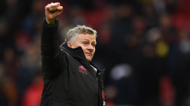 Ekspresi Manajer Manchester United (MU), Ole Gunnar Solskjaer, usai timnya menang 2-0 atas Reading pada Babak Ketiga Piala FA 2018/19 di Old Trafford, Sabtu (5/1/2019). [AFP/Oli Scarff]