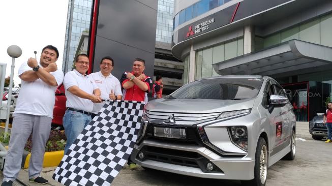 Mitsubishi Owner Club Indonesia ( X-MOC) menggelar kegiatan “Tour de Happiness”, di Tangerang, Sabtu (26/1/2019). [Suara.com/Manuel Jeghesta]