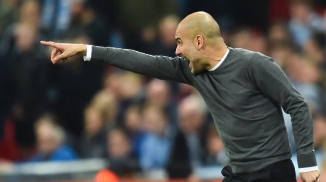 Reaksi manajer Manchester City Pep Guardiola di pinggir lapangan saat skuatnya menghadapi Chelsea di final Piala Liga Inggris di Wembley stadium. Glyn KIRK / AFP