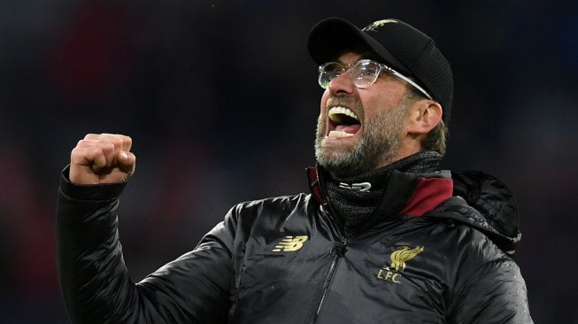 Ekspresi pelatih Liverpool Jurgen Klopp saat merayakan kemenangan timnya atas Bayern Munchen di Allianz Arena, Munich, Jerman, Kamis (14/3) dini hari WIB. [Christof STACHE / AFP]