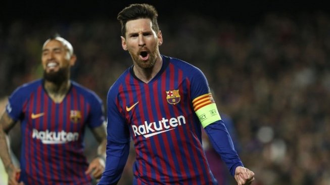 Bintang Barcelona Lionel Messi merayakan golnya ke gawang Lyon pada laga Liga Champions di Camp Nou. PAU BARRENA / AFP