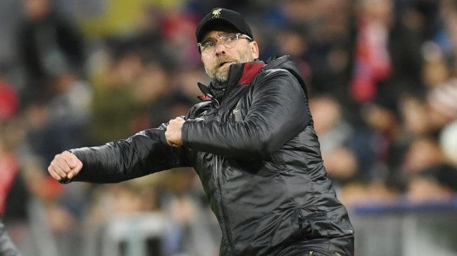 Ekspresi pelatih Liverpool Jurgen Klopp saat merayakan kemenangan timnya atas Bayern Munchen di Allianz Arena, Munich, Jerman, Kamis (14/3) dini hari WIB. [Christof STACHE / AFP]