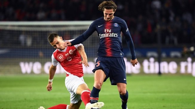 Gelandang sentral Paris Saint-Germain, Adrien Rabiot (kanan). [Anne-Christine POUJOULAT / AFP]