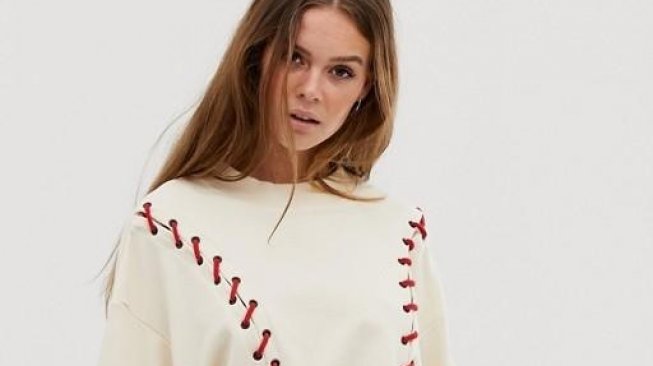 Ivy Park craft line sweatshirt in cream. (ASOS)