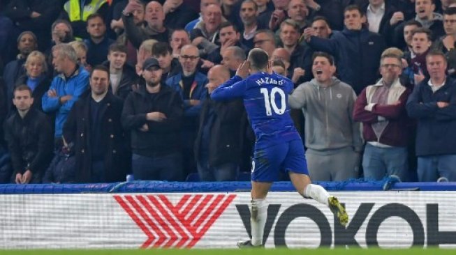 Gelandang Chelsea Eden Hazard merayakan golnya ke gawang West Ham United di Stamford Bridge. OLLY GREENWOOD / AFP 