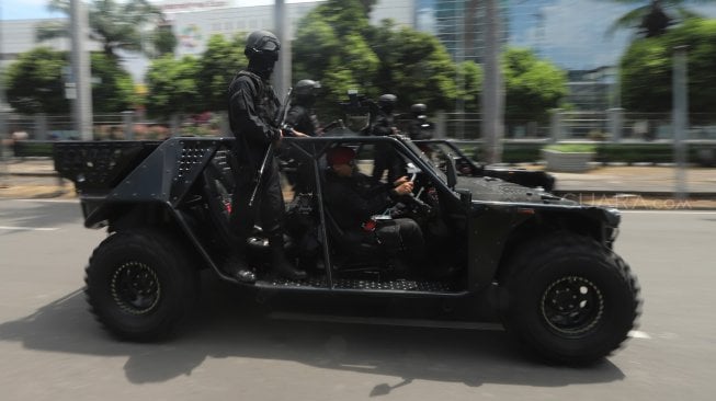 Prajurit SAT-81 Gultor Kopassus saat parade Pemberangkatan Patroli Skala Besar TNI-Polri di JIExpo, Kemayoran, Jakarta Pusat, Minggu (14/4). [Suara.com/Muhaimin A Untung}