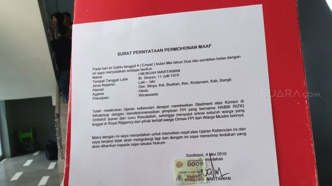 Surat peryataan permohonan maaf I Nengah Wartawan. (Suara.com/Achmad Ali)