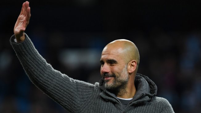 Manajer Manchester City, Pep Guardiola. [Paul ELLIS / AFP]