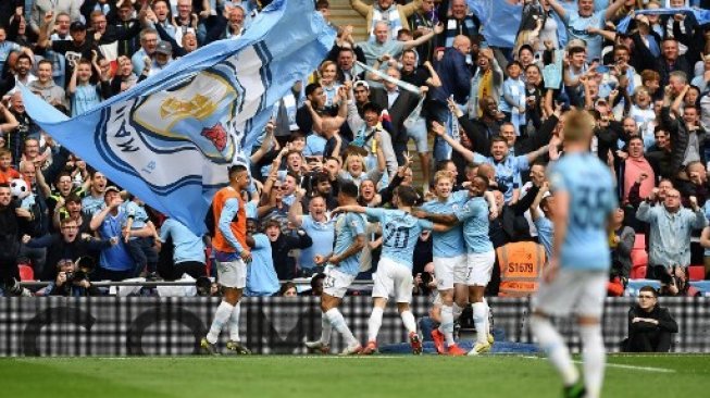 Pemain Manchester City rayakan kemenangan di final Piala FA kontra Watford yang berlangsung di Wembley, Sabtu (19/5/2019) [AFP]