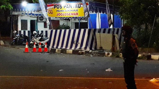 Kondisi tempat kejadian perkara ledakan di Pospam Tugu Kartasura, Sukoharjo, Jawa Tengah, Selasa (4/6/). [ANTARA FOTO/Aloysius Jarot Nugroho]