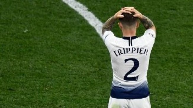 Reaksi Bek Tottenham Hotspur Kieran Trippier setelah kalah dari Liverpool di final Liga Champions. OSCAR DEL POZO / AFP