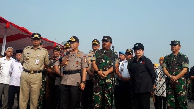 Kapolri Jenderal Tito Karnavian memberikan keterangan pers di Lapangan Silang Monas, Kamis (13/6/2019). [Suara.com/Yosea Arga P]