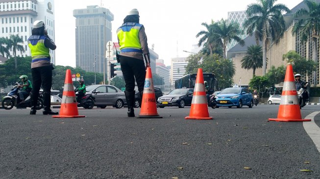 Suasana di Jalan Merdeka Barat, Jakarta, Jumat (14/6). [Suara.com/Oke Atmaja]