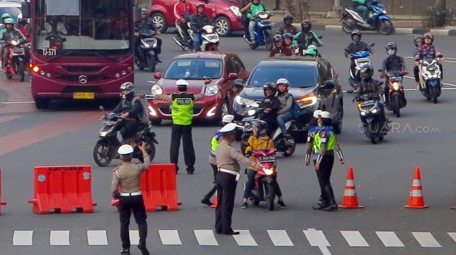 Suasana di Jalan Merdeka Barat, Jakarta, Jumat (14/6). [Suara.com/Oke Atmaja]