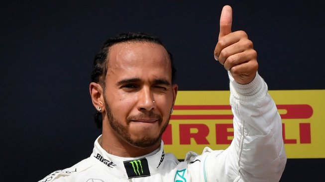 Pebalap Mercedes, Lewis Hamilton memenangi balapan F1 GP Prancis di Sirkuit Paul Ricard, Minggu (23/6/2019). [AFP/Gerard Julien]