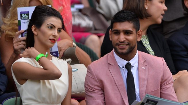 Petinju kenamaan Inggris, Amir Khan (kanan), dan istrinya Faryal Makhdoom. [AFP/Carl Court]