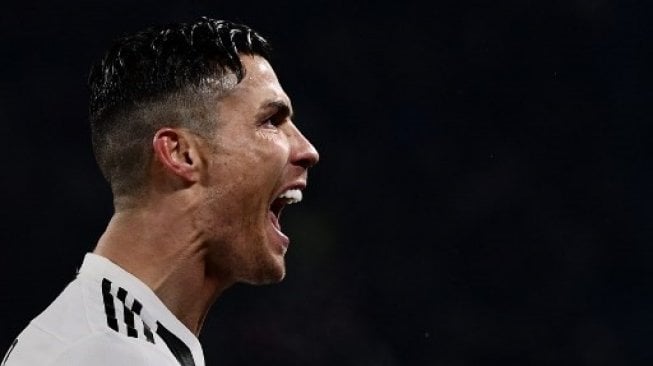 Bintang Juventus Cristiano Ronaldo merayakan golnya. Marco BERTORELLO / AFP
