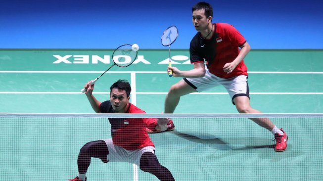 Pasangan ganda putra Indonesia, Hendra Setiawan/Mohammad Ahsan, melaju ke semifinal Japan Open 2019 usai mengalahkan Ko Sung Hyun/Shin Baek Cheol (Korsel), Jumat (26/7). [Humas PBSI]