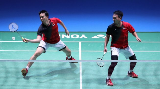 Pasangan ganda putra Indonesia, Hendra Setiawan/Mohammad Ahsan, melaju ke semifinal Japan Open 2019 usai mengalahkan Ko Sung Hyun/Shin Baek Cheol (Korsel), Jumat (26/7). [Humas PBSI]