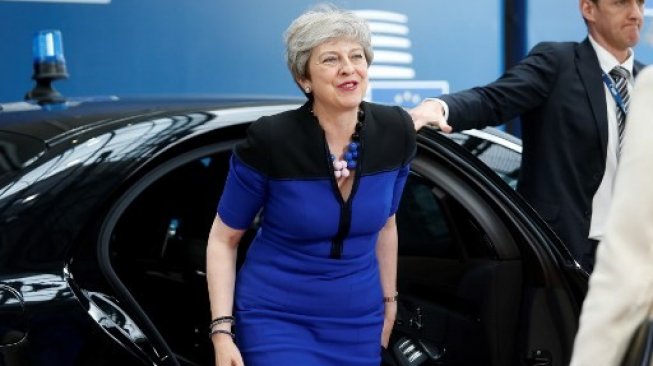 Theresa May, semasa masih menjabat sebagai Perdana Menteri Inggris, hadir di KTT Dewan Eropa, Brussels, Belgia, 20 Juni 2019 [AFP/Pool/Julien Warnand].