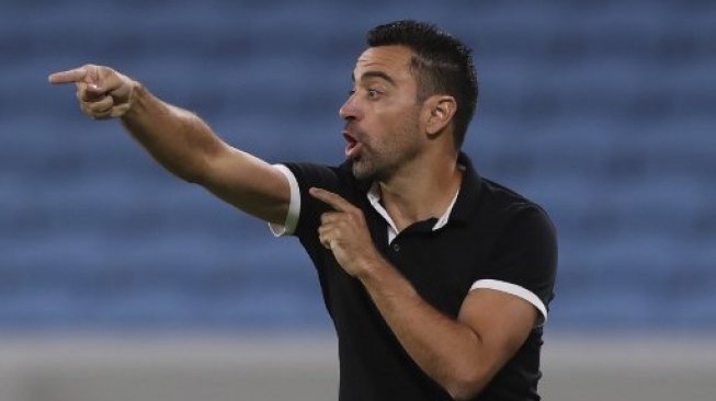 Reaksi pelatih Al Sadd Xavi saat skuatnya menghadapi al-Duhail di Al-Janoub stadium pada ajang Liga Champions Asia. Karim JAAFAR / AFP