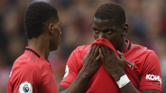 Gelandang Manchester United, Paul Pogba (kanan). [Oli SCARFF / AFP]