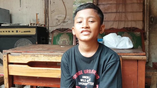 Angga bocah berusia 10 tahun yang sempat viral di medsos karena dikira meninggal. [Suara.com/Supriyadi]