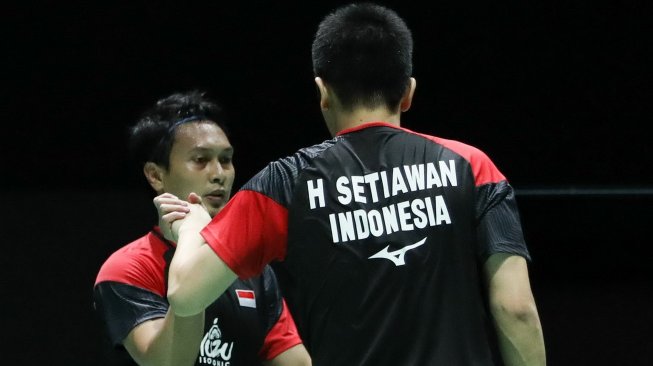 Pasangan ganda putra Indonesia, Hendra Setiawan/Mohammad Ahsan, melaju ke perempat final Kejuaraan Dunia Bulutangkis 2019 usai mengalahkan Alexander Dunn/Adam Hall (Skotlandia), Kamis (22/8). [Humas PBSI]