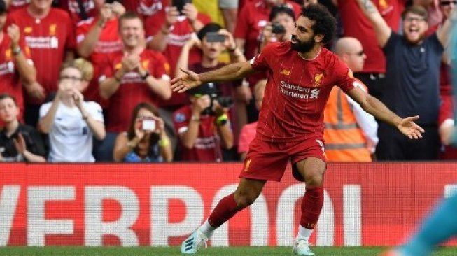 Pemain Liverpool Mohamed Salah merayakan gol keduanya ke gawang Arsenal dalam laga Liga Inggris di Anfield. Ben STANSALL / AFP