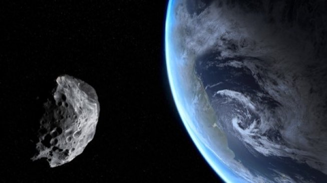 Ilustrasi sebuah asteroid sedang melintas dekat Bumi. [Shutterstock]