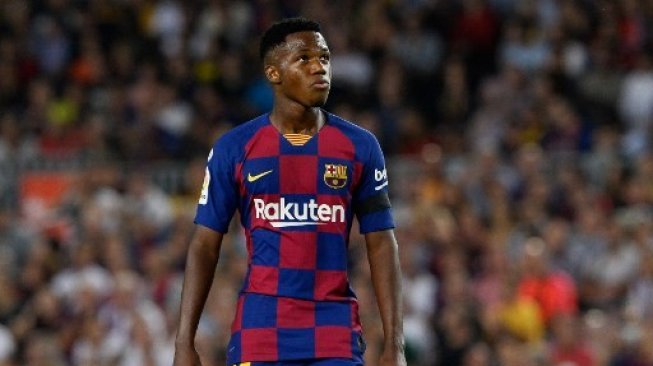 Reaksi pemain muda Barcelona Ansu Fati saat menghadapi Valencia di Camp Nou, Minggu (15/9/2019). [AFP]