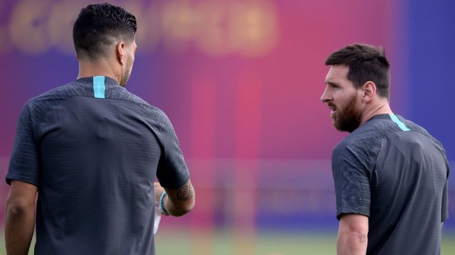 Megabintang Barcelona, Lionel Messi sudah kembali mulai berlatih bersama timnya di Joan Gamper Sports City, Barcelona, jelang laga Liga Champions 2019/2020 kontra Borussia Dortmund. [PAU BARRENA / AFP]