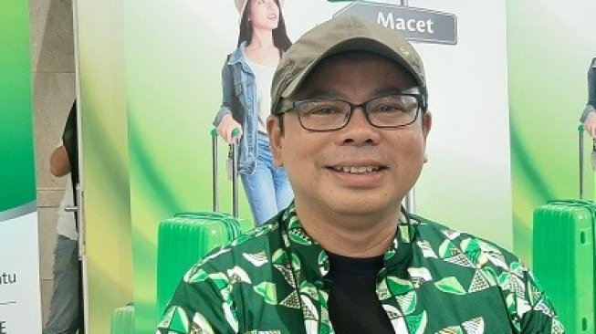 Travel blogger Awan Yulianto bicara soal pengalaman lebih murah liburan ke luar negeri daripada di dalam negeri. (Suara.com/Dini Afrianti)