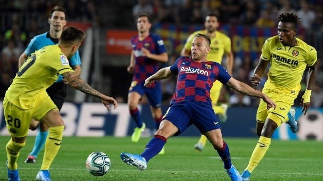 Gelandang Barcelona Arthur Melo mencetak gol kemenangan saat menjamu Villarreal di Camp Nou, Rabu (25/9/2019) dini hari WIB. (AFP)