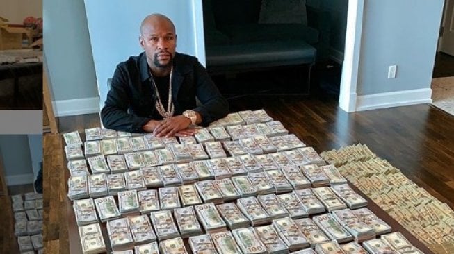 Legenda tinju dunia, Floyd Mayweather Jr., memamerkan pundi-pundi uang berlimpah miliknya. [Instagram/floydmayweather]