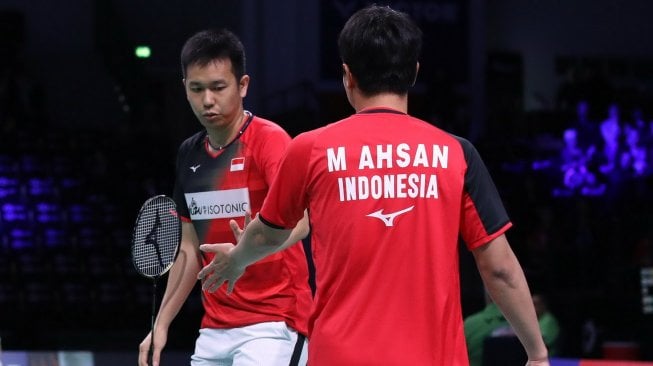 Pasangan ganda putra Indonesia, Hendra Setiawan/Mohammad Ahsan, melaju ke perempat final Denmark Open 2019 usai mengalahkan Aaron Chia/Soh Wooi Yik (Malaysia), Kamis (17/10). [Humas PBSI]